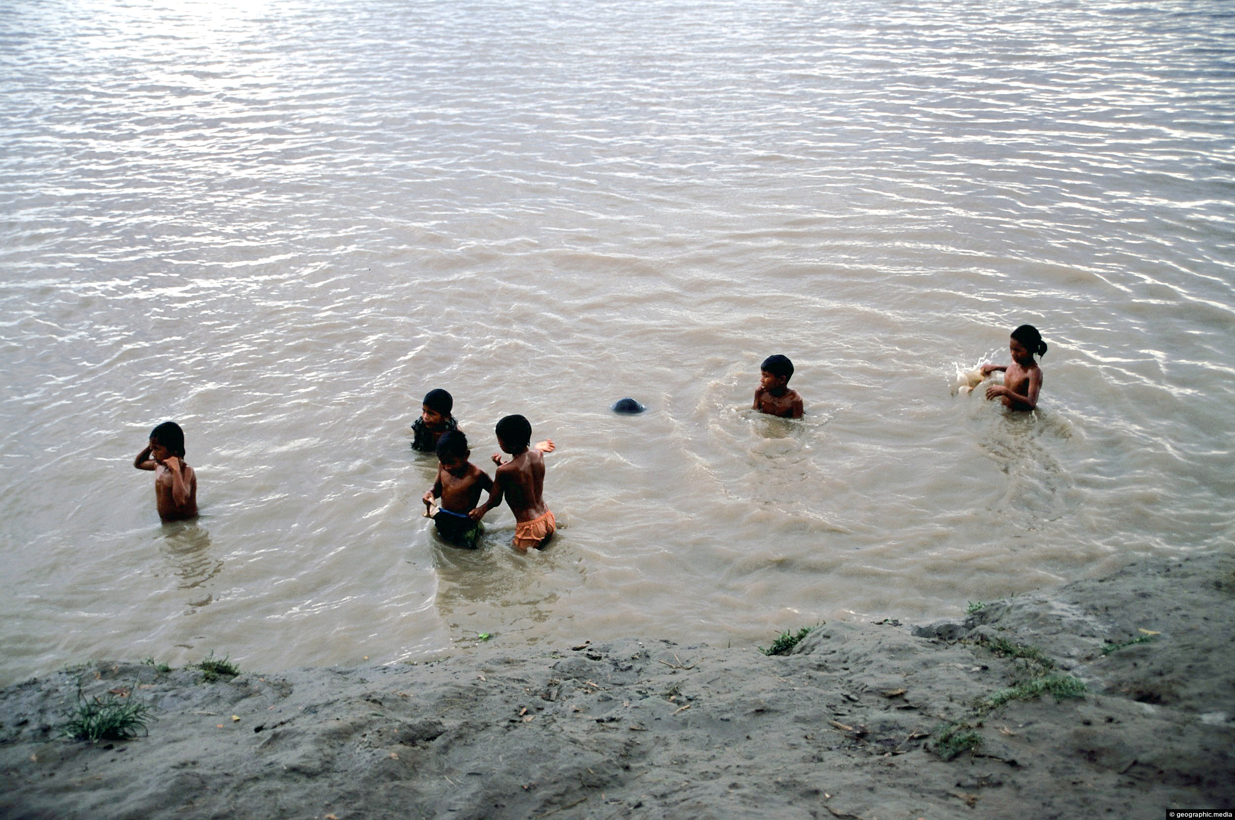 Children swimming in the Amazon River