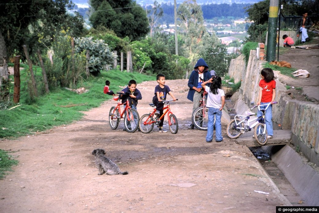 Chia Children playing on bikes