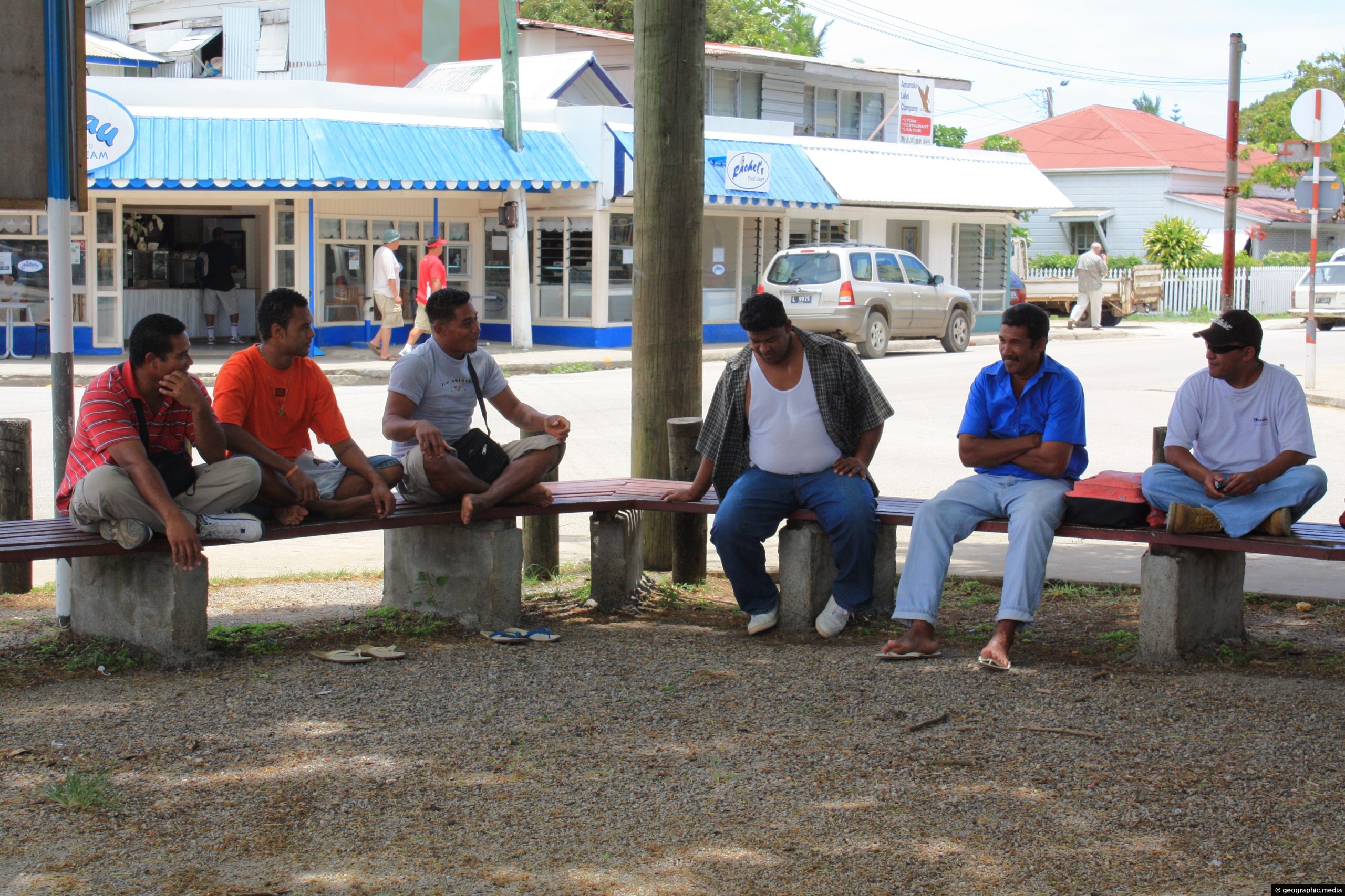 Tongan men resting during the heat of the day